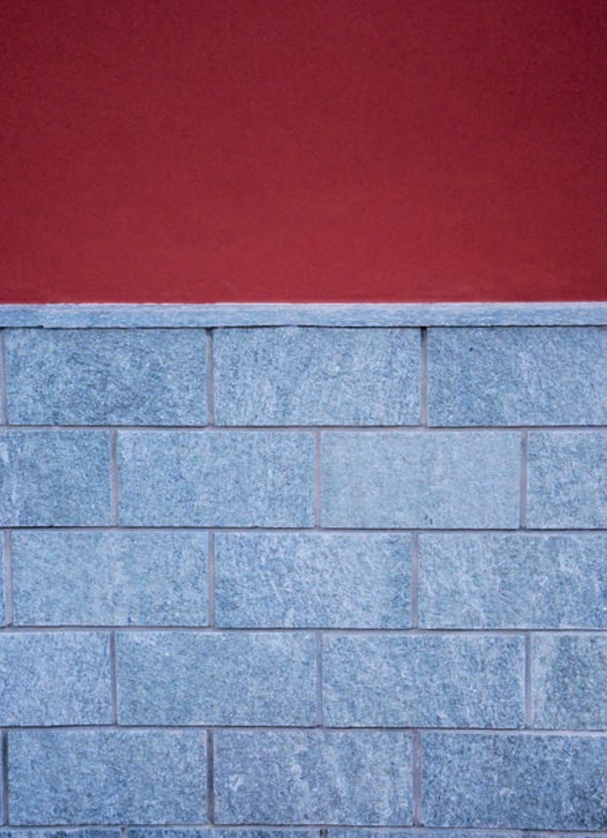 Natural split cladding installed wall